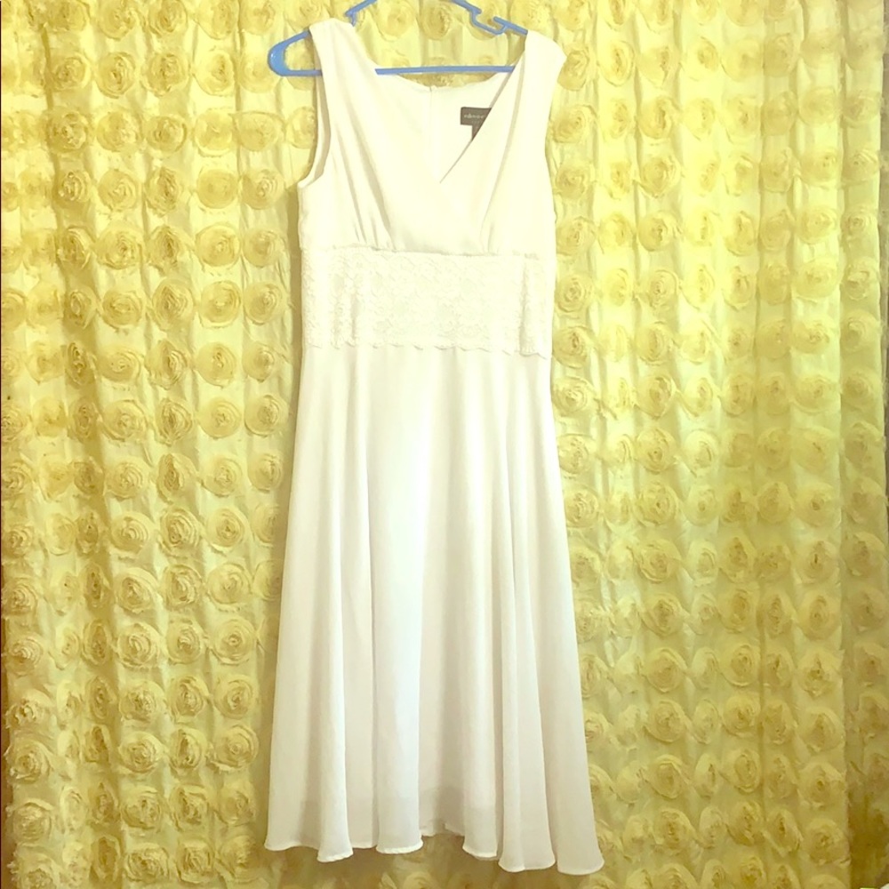 white dress. Hem damage otherwise great condition